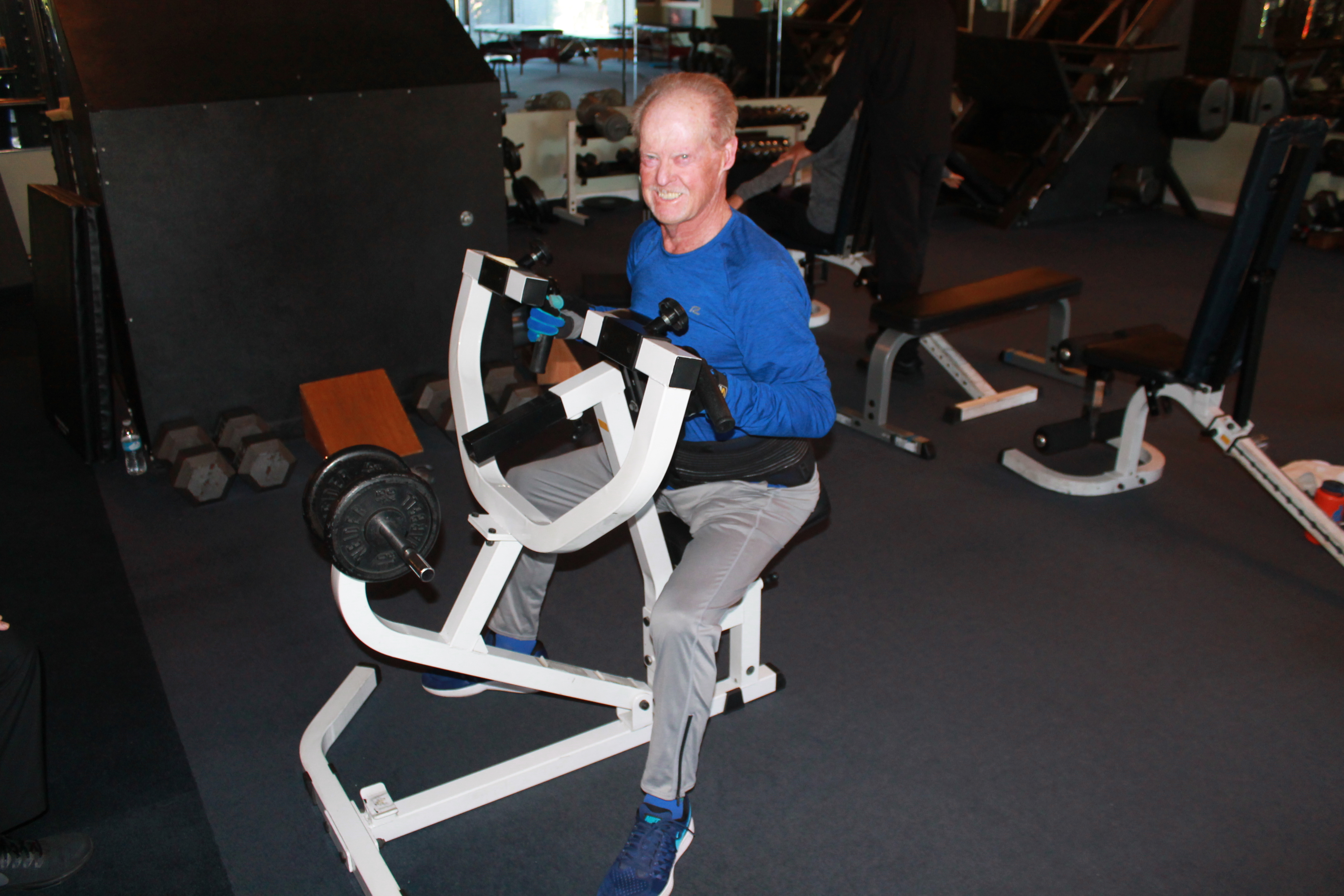 Client exercising with a trainer in Gill’s Fitness private gym